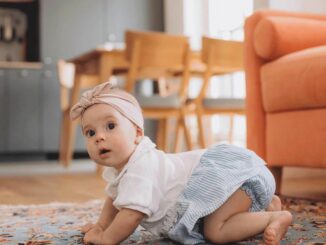 A Baby Crawling on the Floor