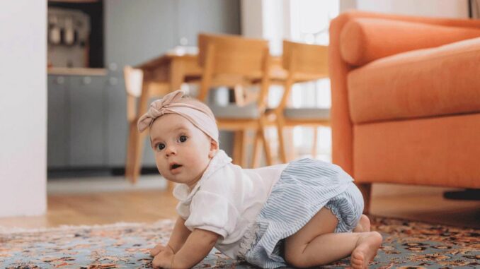 A Baby Crawling on the Floor