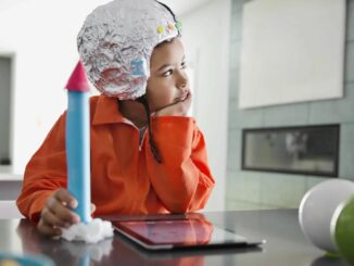 A Child Holding a Toy Rocket