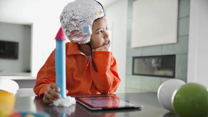 A Child Holding a Toy Rocket